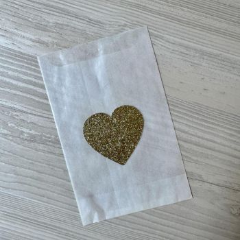 Bolsita semitransparente corazón dorado