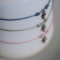 Hanging small cross bracelet
